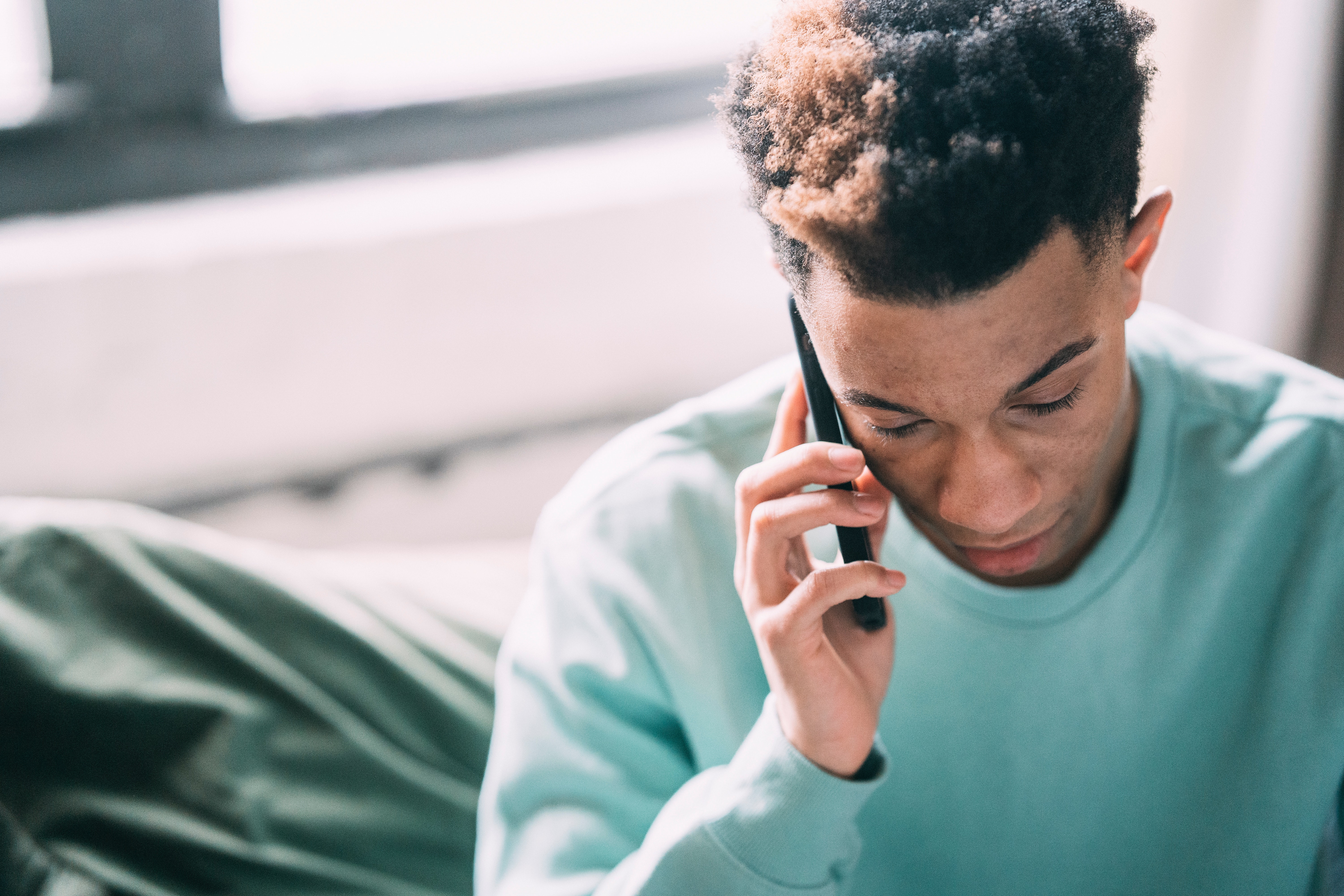 Ethnic man taking a phone call