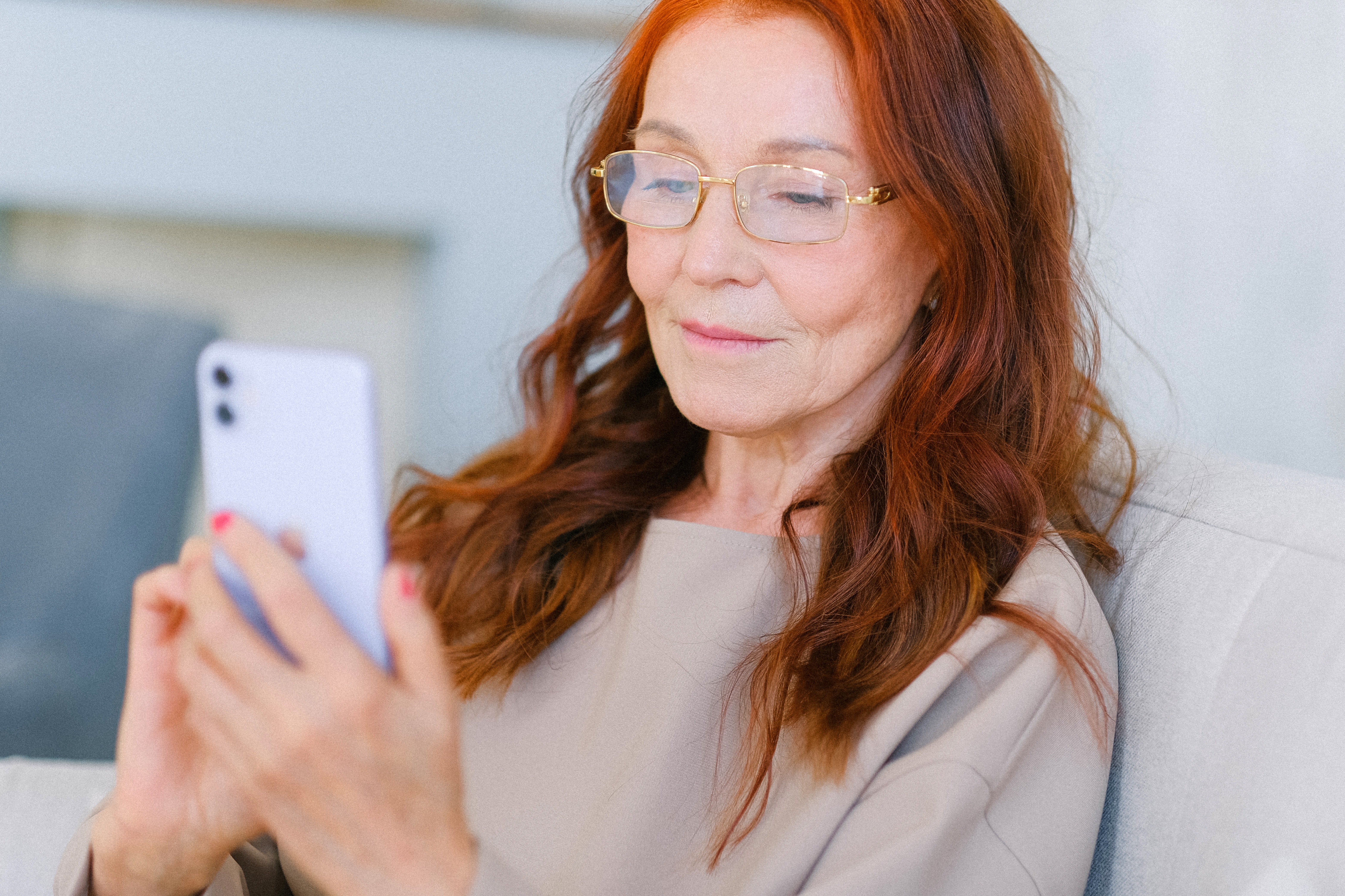 Older lady looking at her smart phone