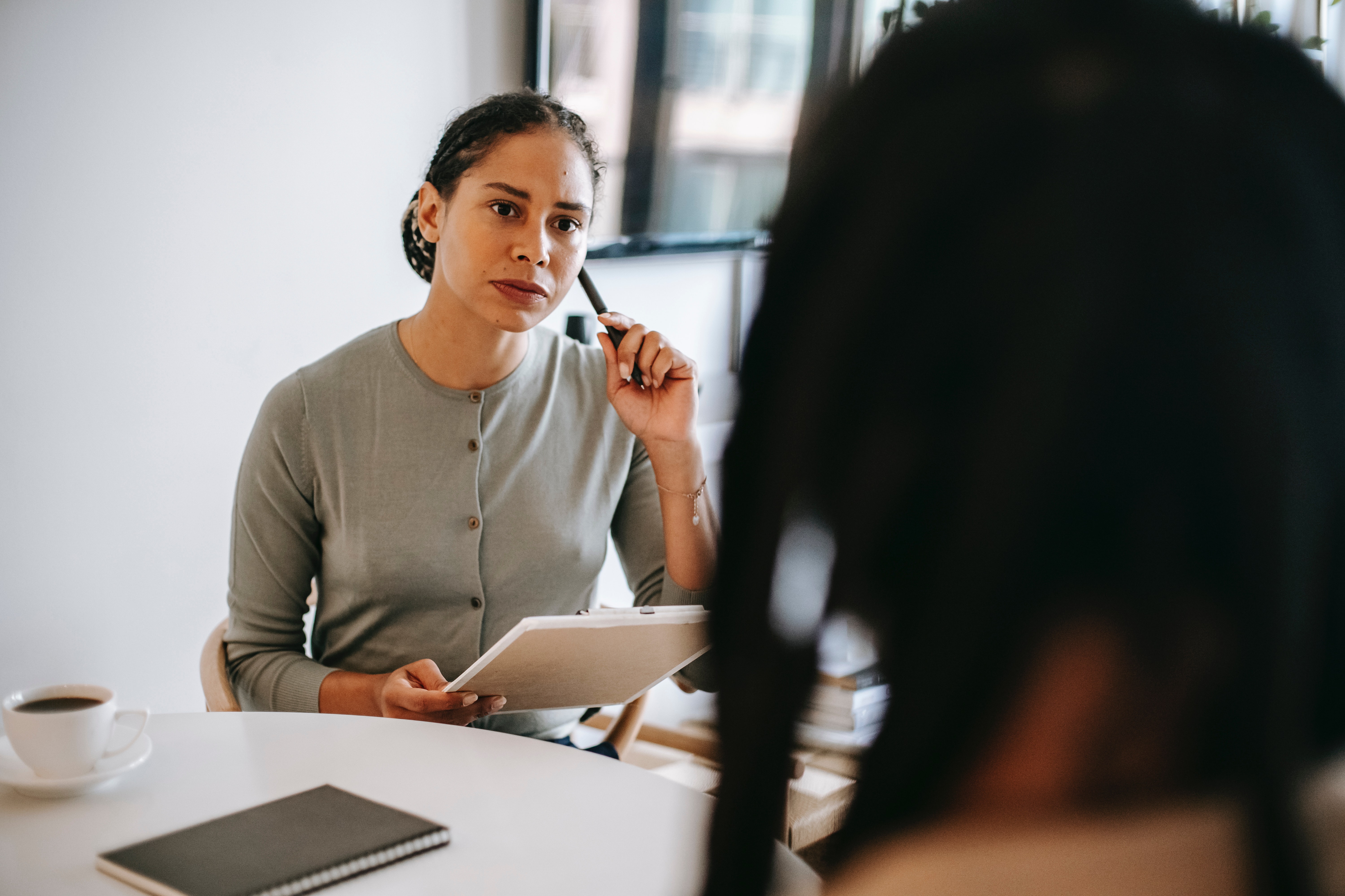 Woman looking thoughtful asking a question